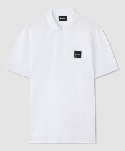 Polo bianco in cotone con badge Norton ricamato