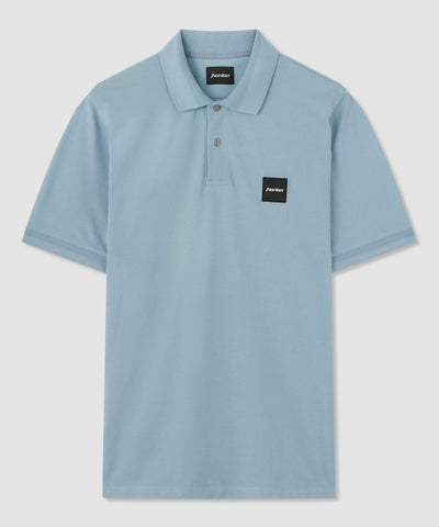 Polo blu in cotone con badge Norton ricamato